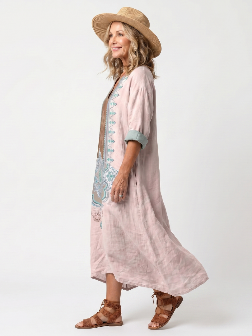Pink relaxed midi dress profile with turquoise trim and 3/4 sleeves