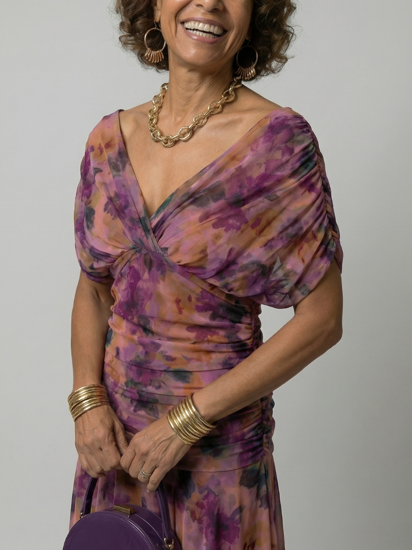 Off-shoulder purple floral midi dress with twisted bodice detail and gathered sleeves