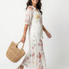 White floral tiered midi dress with V-neck and puff sleeves, tiered hem