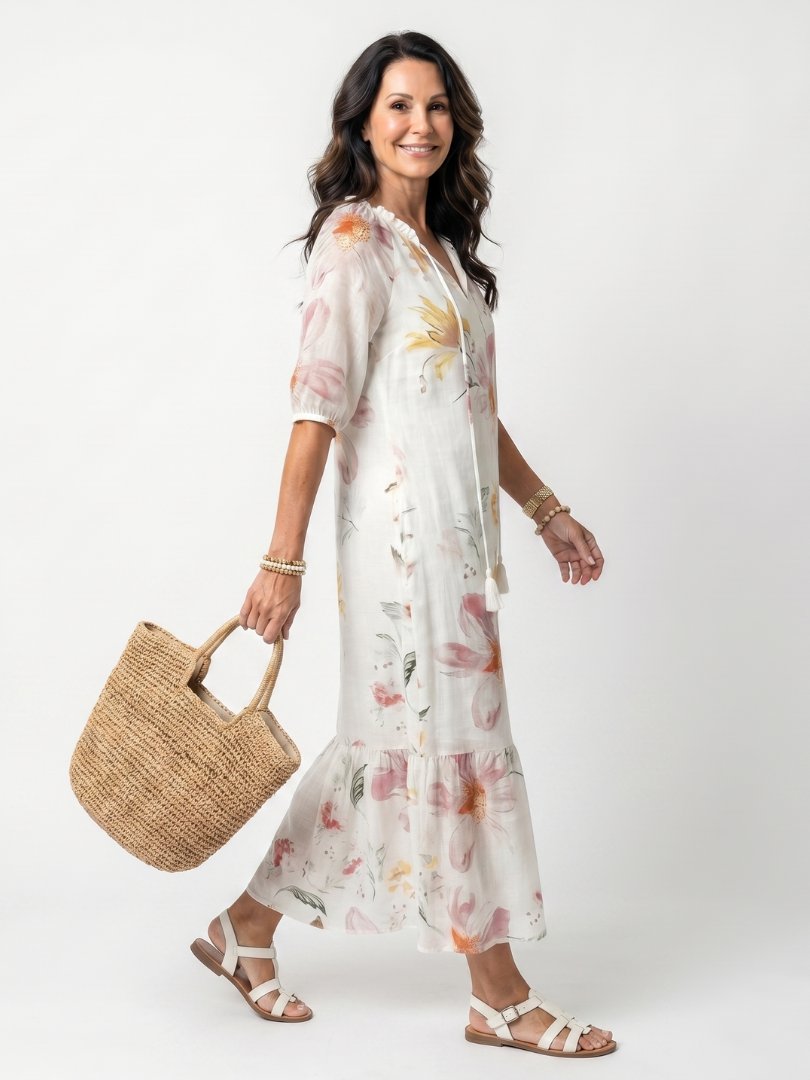 White floral tiered midi dress with V-neck and puff sleeves, tiered hem