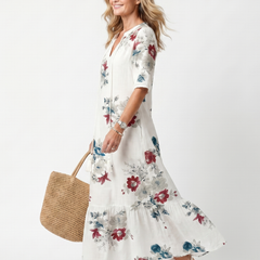 White floral midi dress with short sleeves and tiered skirt