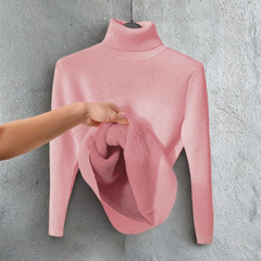 Pink turtleneck long-sleeve sweater with ribbed collar; folded scarf draped on front