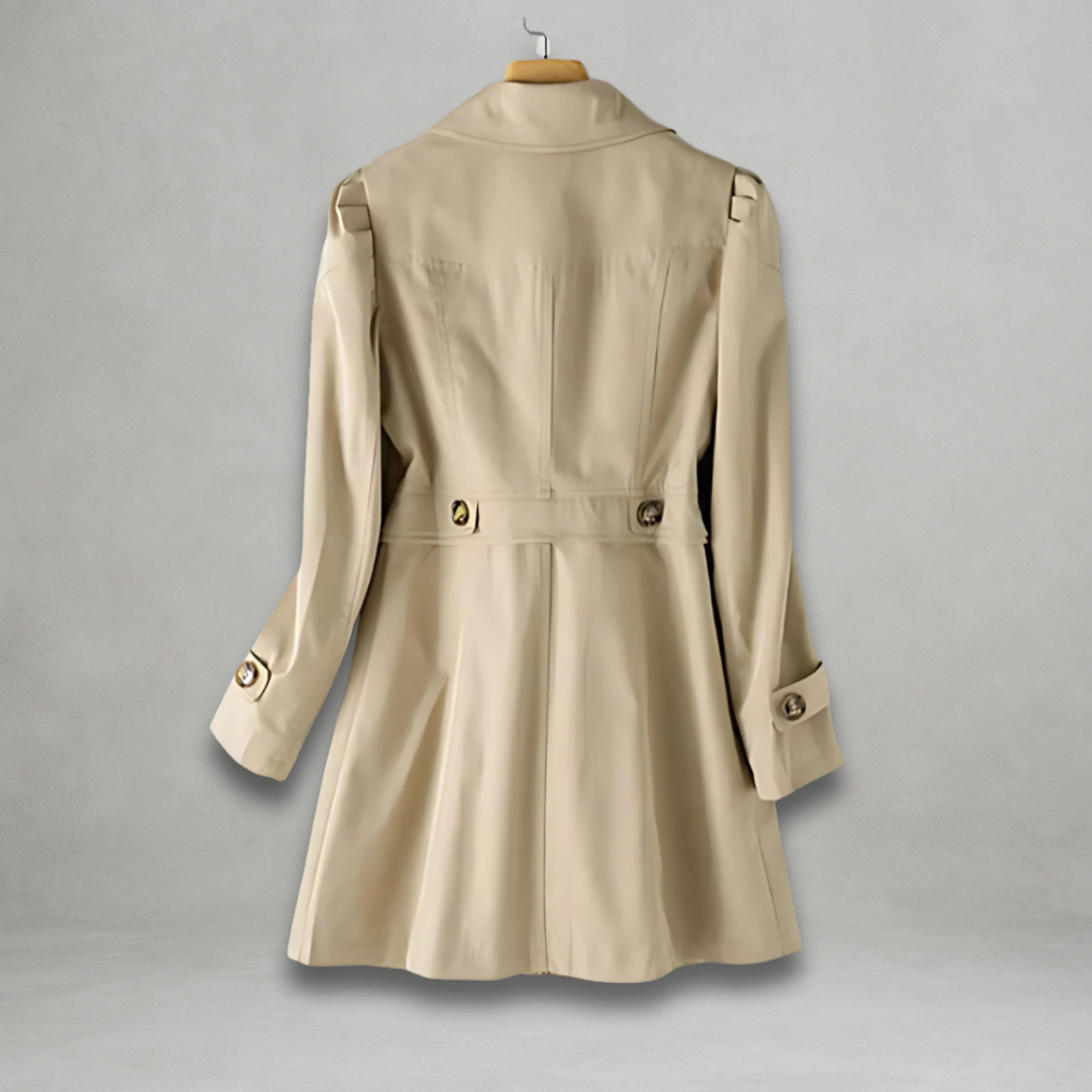 Cream trench coat back view with waist belt and vented hem