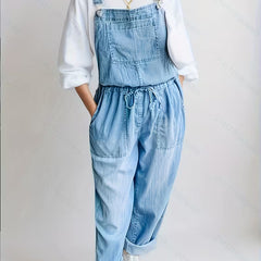 Blue denim relaxed wide-leg overalls with adjustable straps and front bib pocket
