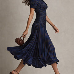 Dark blue striped satin midi dress from side, V-neck with short puff sleeves and pleated hem.