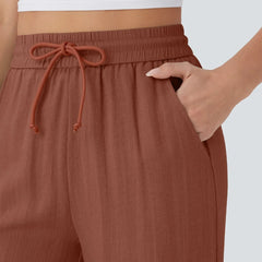 Rust wide-leg trousers with elastic waistband and drawstring tie
