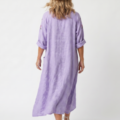 Purple floral pocket midi dress, back view, elbow-length puff sleeves