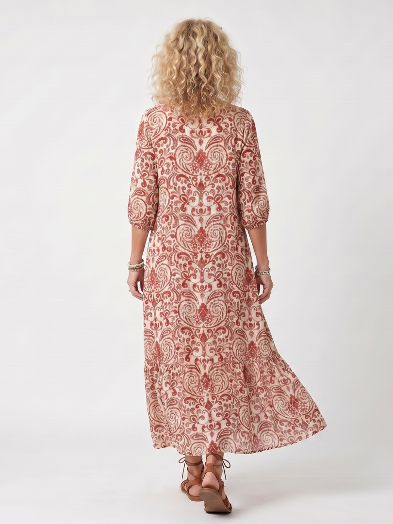 Back view red paisley tie-neck midi dress with flared skirt and 3/4 sleeves