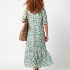 Green patterned V-neck midi dress, back view with three-quarter sleeves