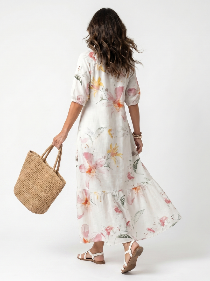 White floral tiered midi dress with V-neck and three-quarter puff sleeves