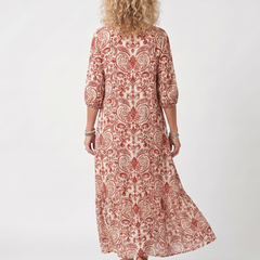Red ornate print midi dress back view with three-quarter sleeves and flared hem