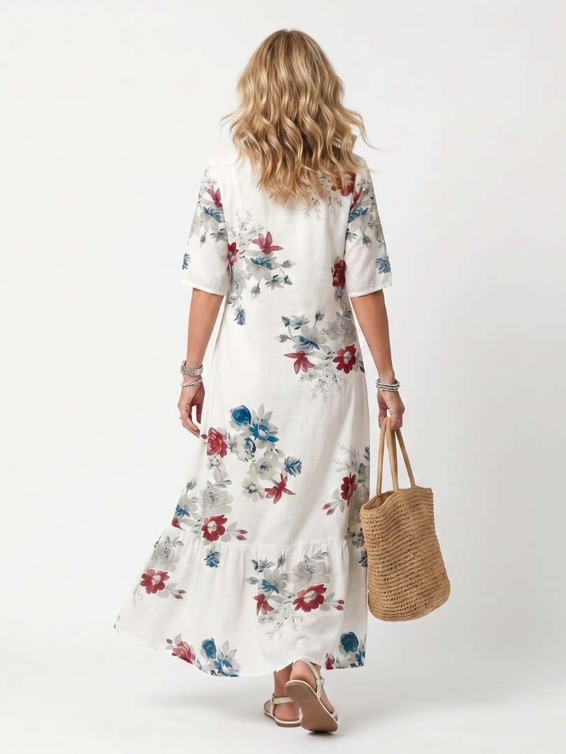 White floral tie-neck midi dress, back view, short sleeves and tiered skirt.