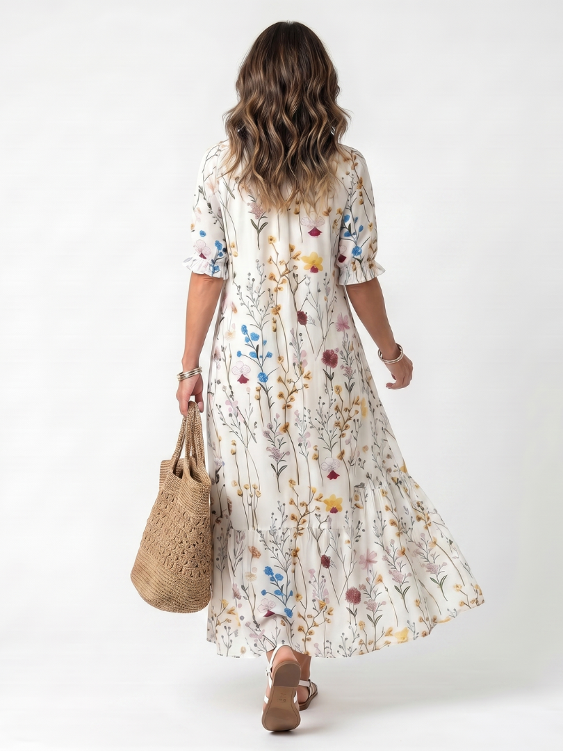 White botanical print midi dress back view with puff sleeves and tied neckline