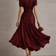 Red striped satin midi dress from back, fitted ruched waist and full pleated skirt.