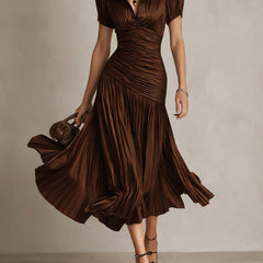 Brown striped satin midi dress with V-neck, gathered ruched bodice, short sleeves, flared pleats.