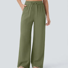 Green wide-leg trousers with elastic waistband and drawstring ties