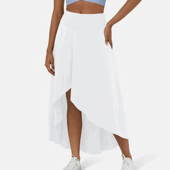 Asymmetric midi skirt in white with high-low hem and draped side panel
