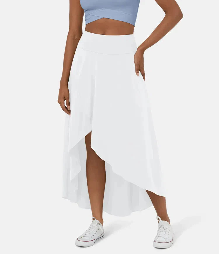 Asymmetric midi skirt in white with high-low hem and draped side panel