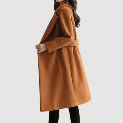 Tan classic coat with belt, long sleeves, notched lapels, button front.