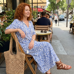Blue printed tie-neck midi dress with short sleeves and flowing skirt