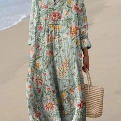 Boho maxi dress in light green with colorful floral print, V-neck and loose 3/4 sleeves
