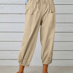 Khaki relaxed-fit trousers with elastic waist, drawstring, side pockets, button cuff hem.