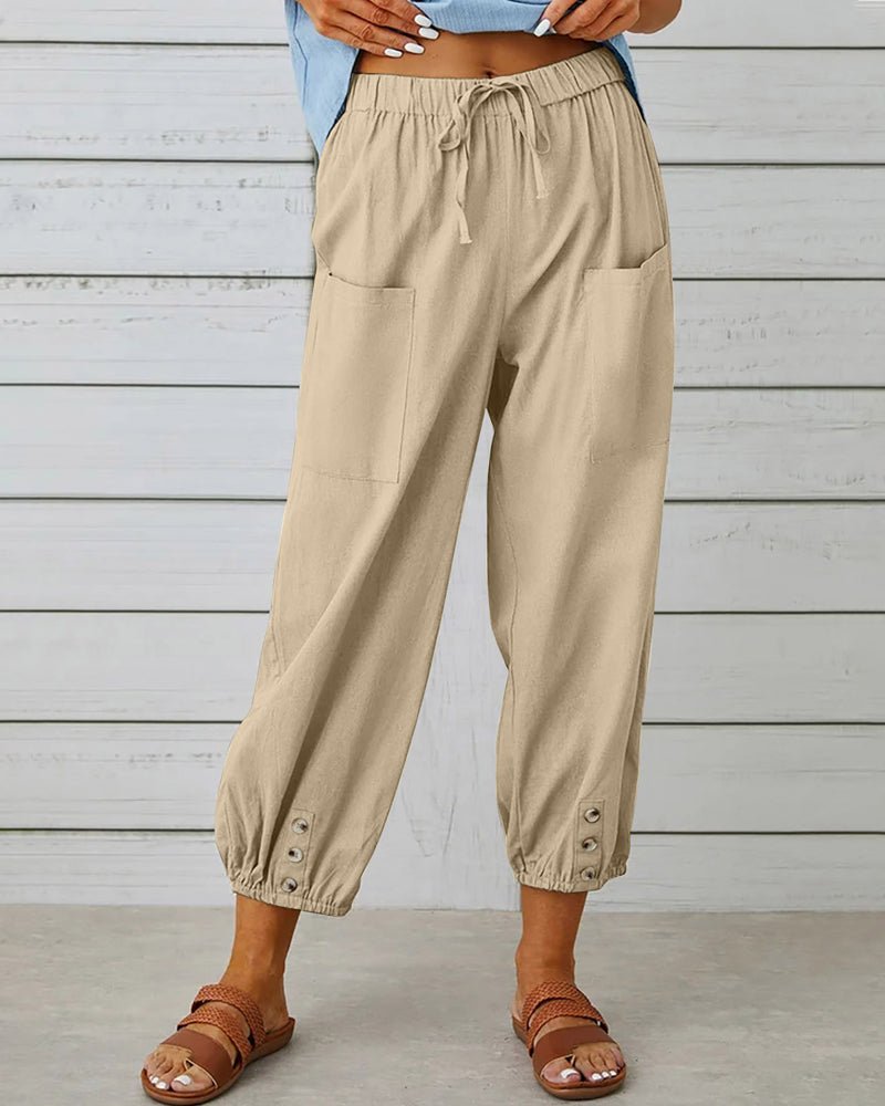 Khaki relaxed-fit trousers with elastic waist, drawstring, side pockets, button cuff hem.