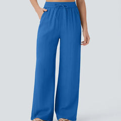 Blue wide-leg trousers with elastic waistband and drawstring ties