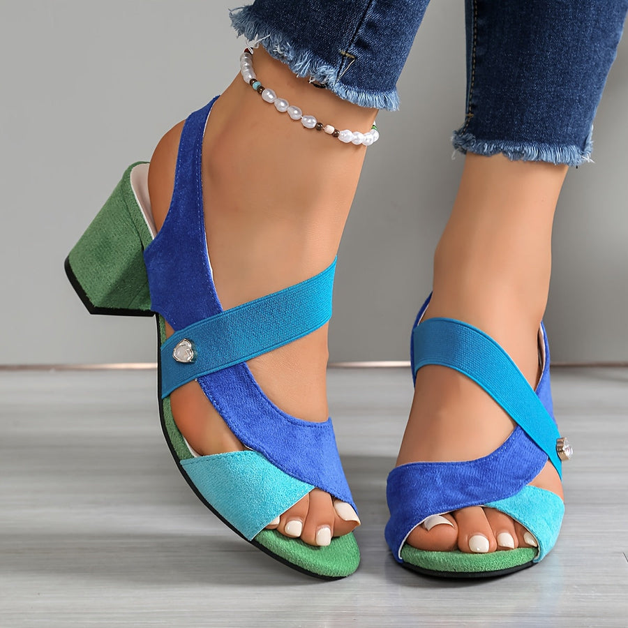 Blue suede block-heel sandals with crisscross straps and small silver stud detail