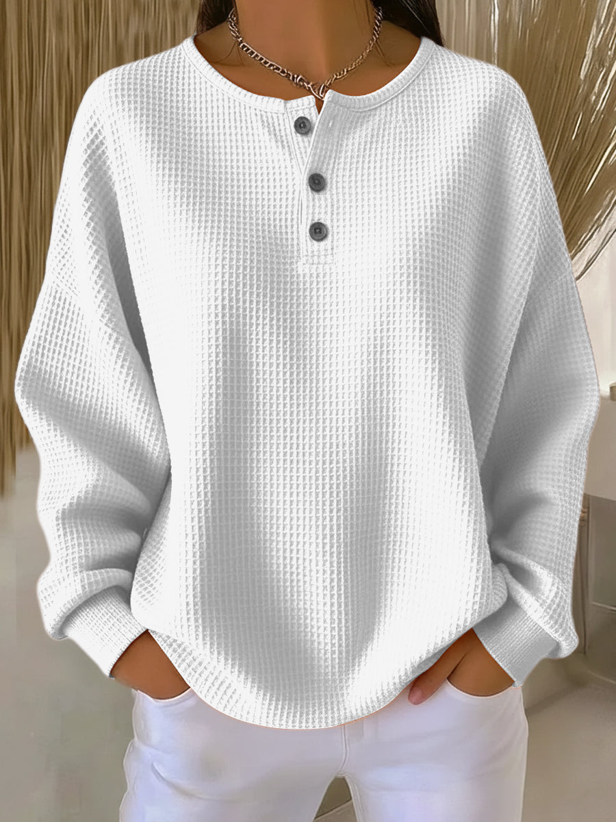 White waffle henley sweatshirt with buttoned neckline and long sleeves