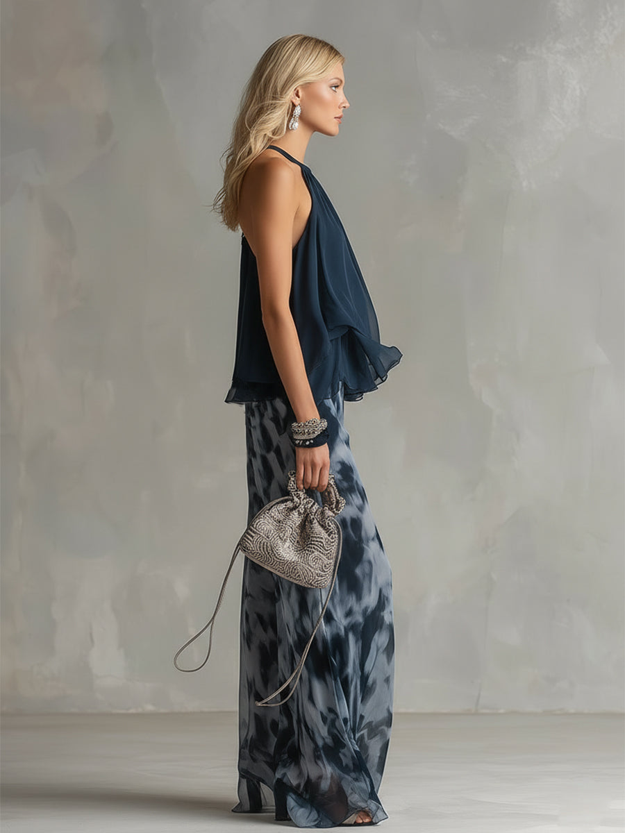 Two-piece halter ruffle top and wide-leg printed pants set, side view with drape