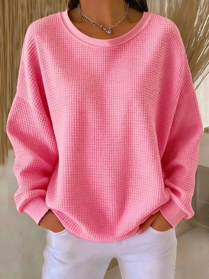 NYLA classic sweater in pink waffle-knit, crewneck, long sleeves with ribbed cuffs.