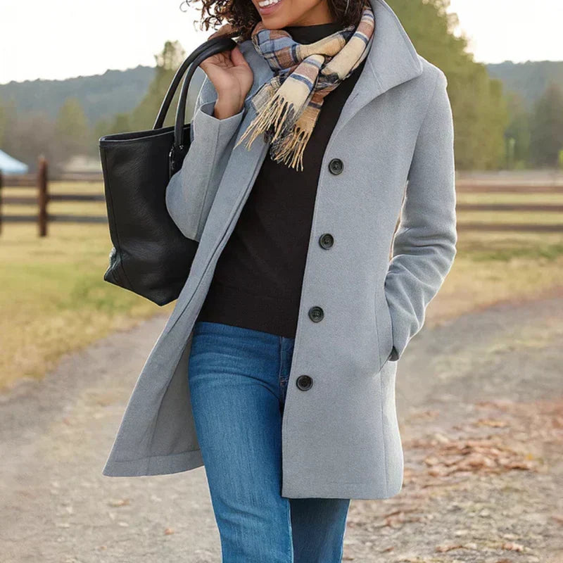 Light gray single-breasted coat with notched lapel and dark button front
