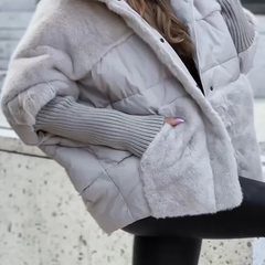 Ivory plush hooded puffer jacket with zip front and faux-fur trim, ribbed cuffs