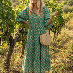 Dark green floral print V-neck tiered midi dress with full, tiered skirt and 3/4 sleeves