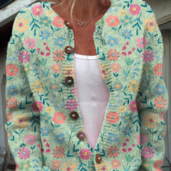 Women's vintage floral cardigan in teal with button-front and brown buttons