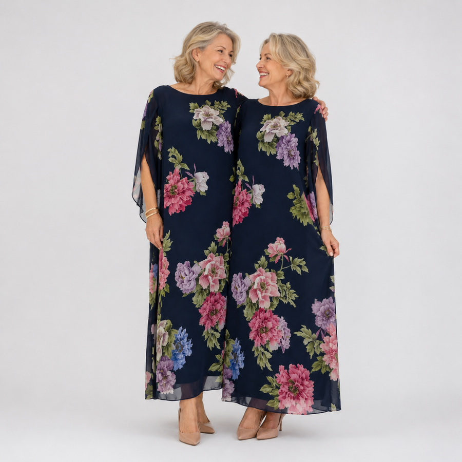 Navy floral maxi dress with loose cape sleeves and flowing chiffon drape