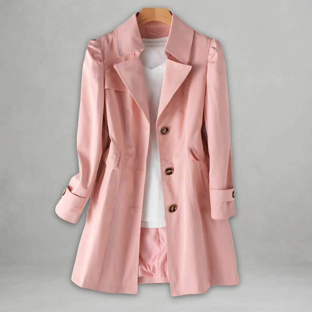 Pink trench coat with notched lapels, double-breasted buttons, and cuff tab details