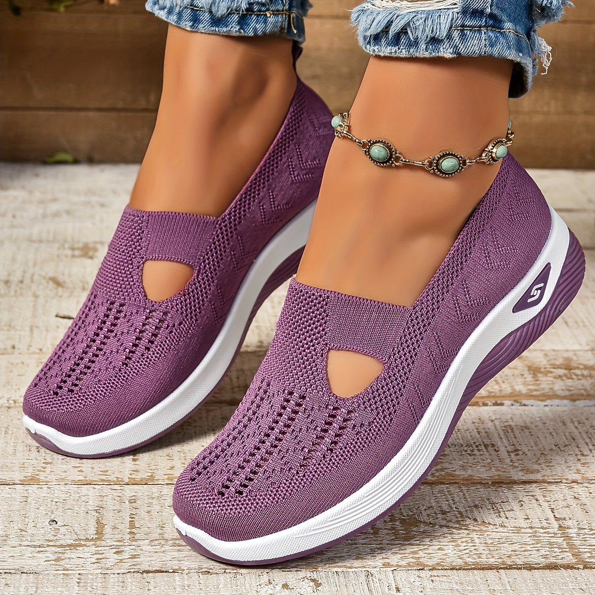 Purple knit slip-on shoes with side cutouts and white sole