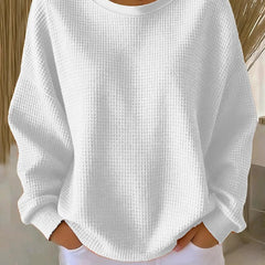 NYLA classic sweater in white waffle-knit, crewneck, long sleeves with ribbed cuffs.
