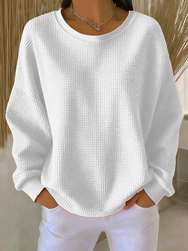 NYLA classic sweater in white waffle-knit, crewneck, long sleeves with ribbed cuffs.