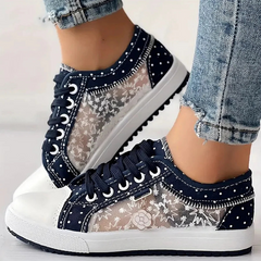 Navy floral lace-up sneakers with white polka dots and stitched border, platform rubber sole.