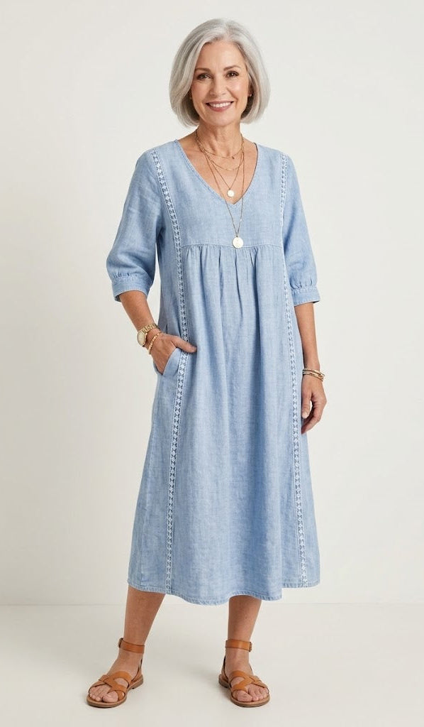 Light blue A-line maxi dress with V-neck, elbow sleeves, and gathered waist seams