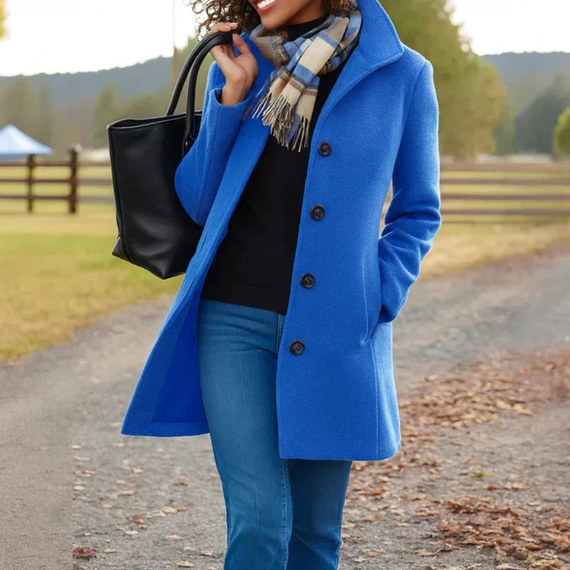 Bright blue single-breasted coat with notched lapel and dark button front