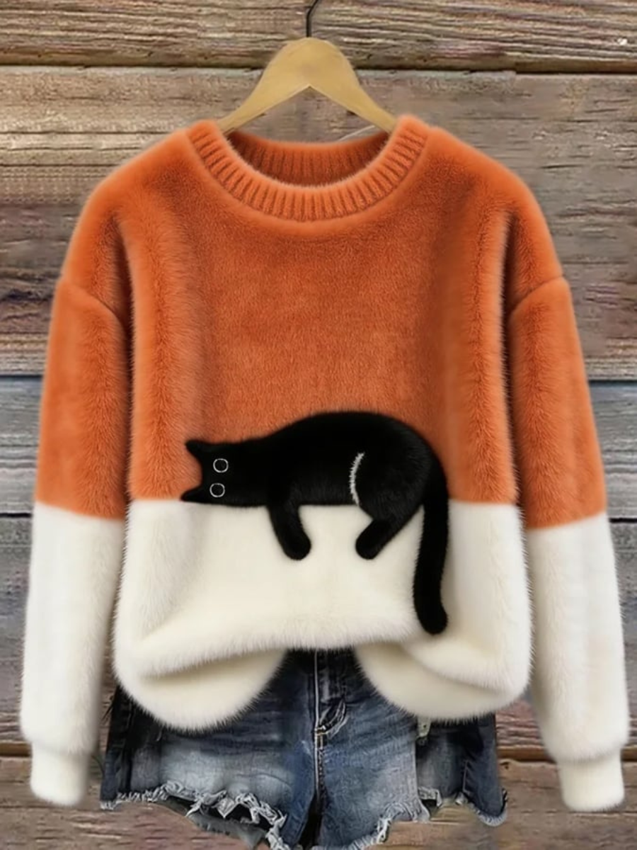 Orange oversized sweater with white cuffs and hem, black cat graphic front.