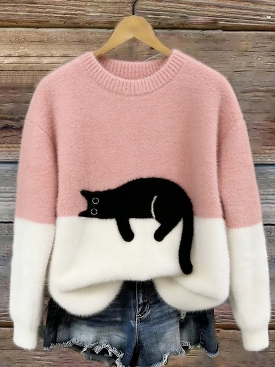 Pink oversized sweater with white cuffs and hem, black cat graphic front.