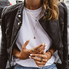 Dark leather biker jacket with snap collar and asymmetrical front zippers