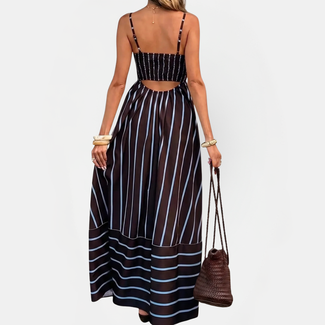 Navy striped maxi dress with thin straps, open back, and gathered full skirt