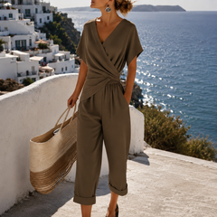 Olive wrap-front jumpsuit with V-neck, short sleeves, and belted cropped pants
