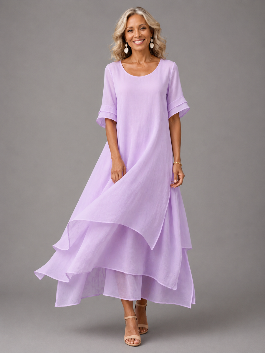 Purple flowing maxi dress with short sleeves and tiered ruffle hem